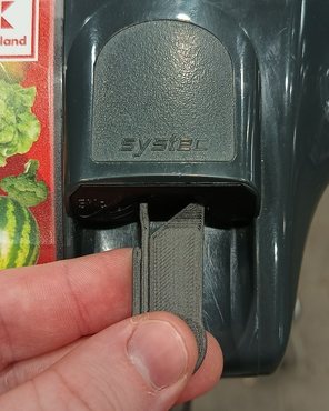 Push the tool into the coin slot