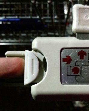 Hold the drawer shut and remove the pick